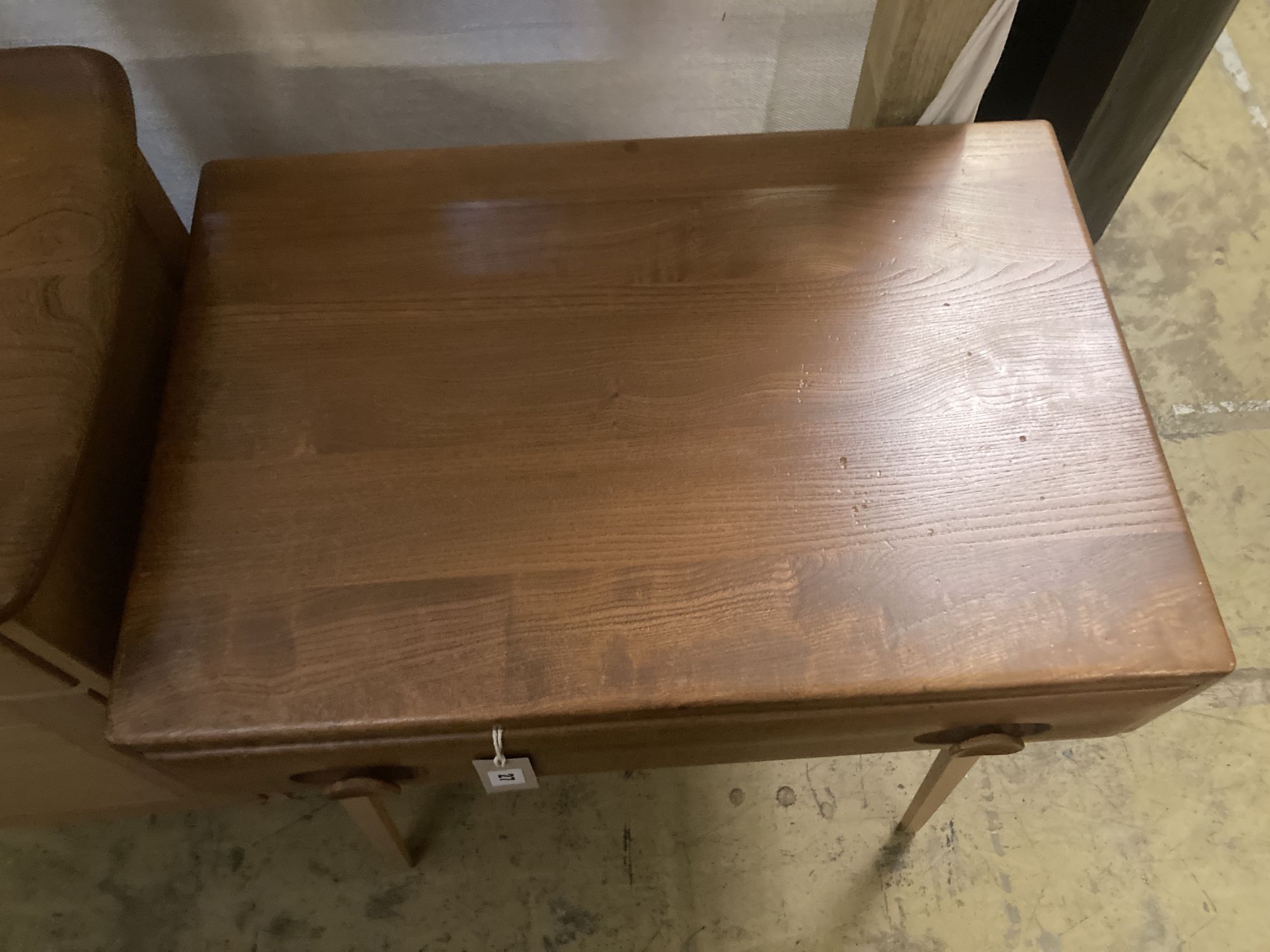 An Ercol elm side table fitted single frieze drawer, width 68cm depth 48cm height 75cm
